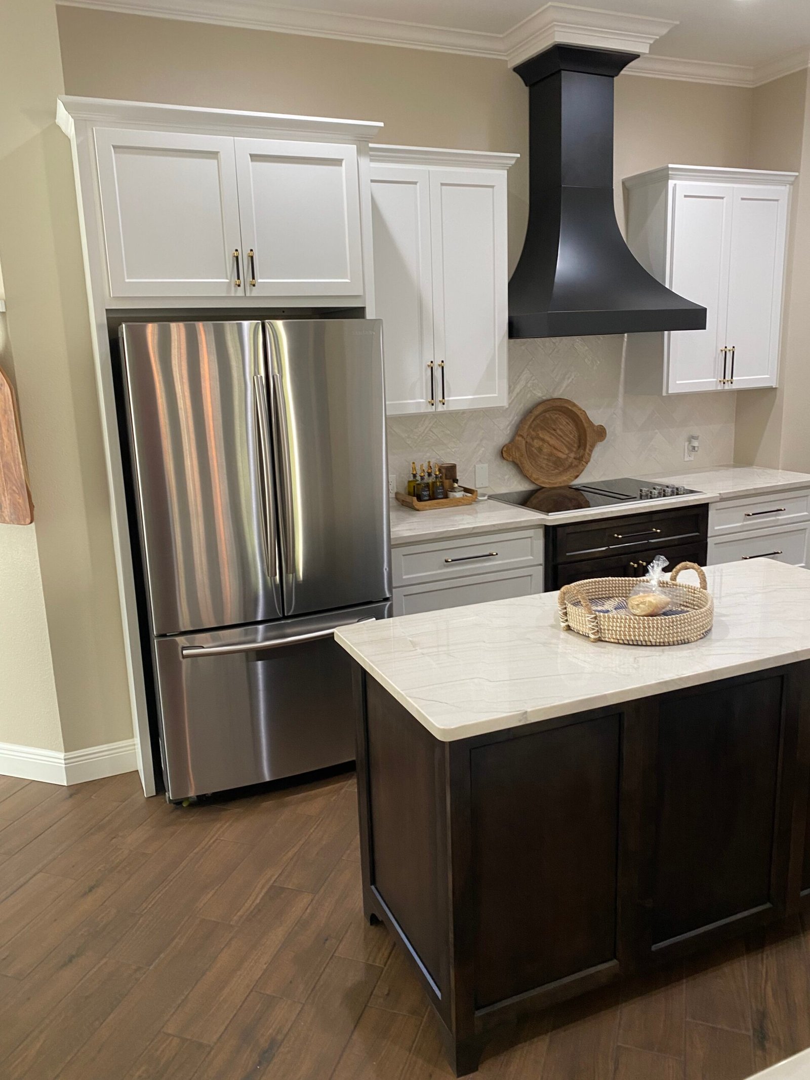 Cabinet specialist measuring kitchen walls and planning precise custom cabinet installation